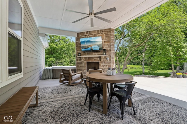 9155 Kerwood Dr, Indianapolis, IN 46240 - view of patio / terrace with an outdoor stone fireplace, ceiling fan, and outdoor dining area