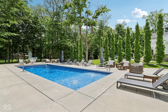 9155 Kerwood Dr, Indianapolis, IN 46240 - outdoor pool featuring a patio area and view of wooded area