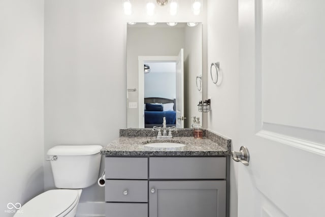 9155 Kerwood Dr, Indianapolis, IN 46240 - half bathroom featuring vanity, toilet, and ensuite bathroom