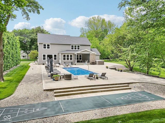 9155 Kerwood Dr, Indianapolis, IN 46240 - back of property featuring an outdoor pool and a patio area