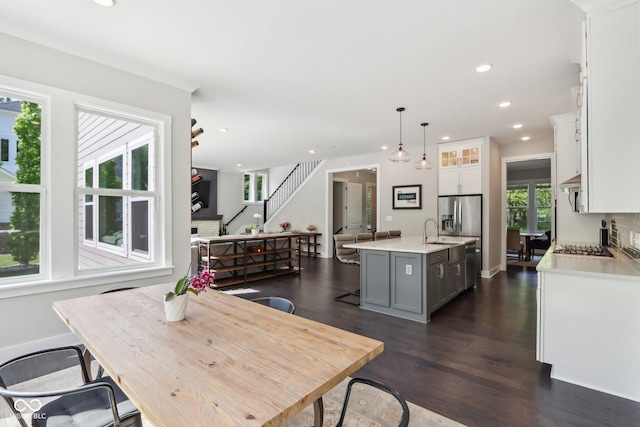 9155 Kerwood Dr, Indianapolis, IN 46240 - dining area featuring dark wood-style flooring, recessed lighting, stairs, and baseboards