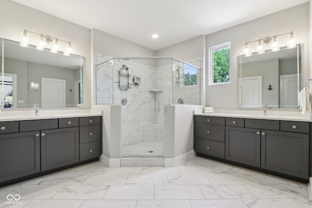 9155 Kerwood Dr, Indianapolis, IN 46240 - full bathroom featuring marble look tile flooring, a stall shower, two vanities, and recessed lighting