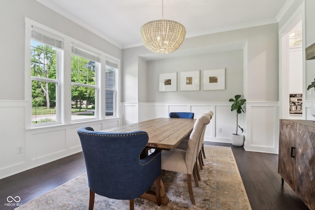 9155 Kerwood Dr, Indianapolis, IN 46240 - dining area featuring a chandelier, plenty of natural light, a decorative wall, crown molding, and dark wood finished floors