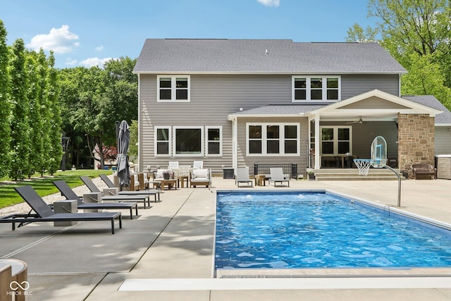 9155 Kerwood Dr, Indianapolis, IN 46240 - back of property featuring a patio area, an outdoor pool, and ceiling fan