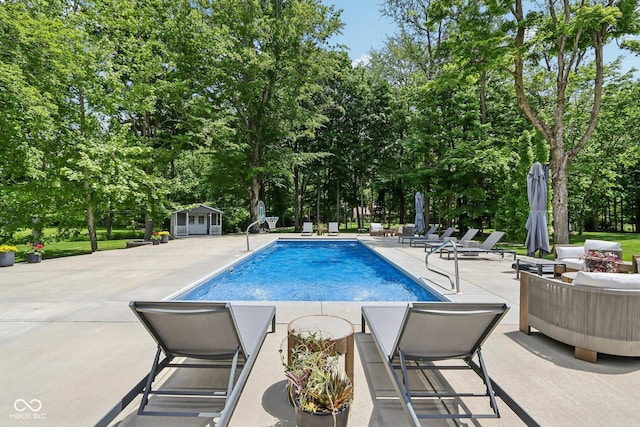 9155 Kerwood Dr, Indianapolis, IN 46240 - outdoor pool with a patio, view of scattered trees, an outdoor structure, and an outdoor hangout area