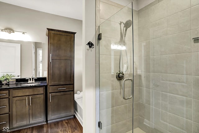 6153 Dugan Dr, Whitestown, IN 46075 - full bathroom with a shower stall, vanity, and wood finished floors