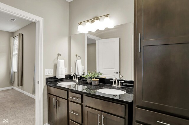 6153 Dugan Dr, Whitestown, IN 46075 - full bath with baseboards and double vanity