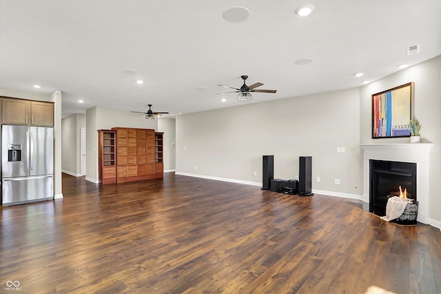 6153 Dugan Dr, Whitestown, IN 46075 - unfurnished living room featuring a fireplace with flush hearth, recessed lighting, a ceiling fan, dark wood-style floors, and baseboards