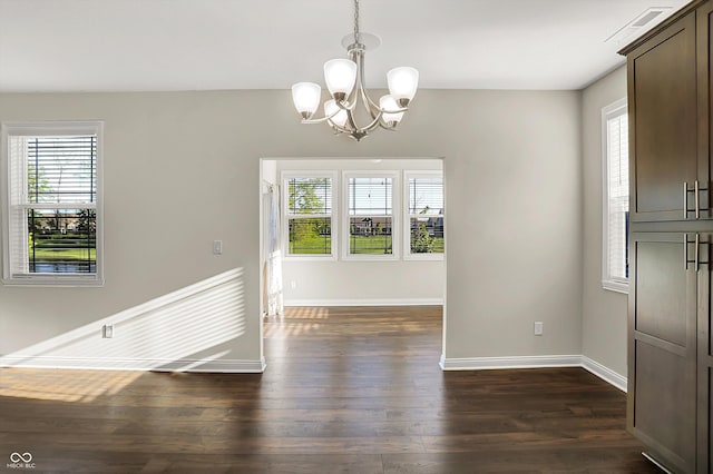 6153 Dugan Dr, Whitestown, IN 46075 - unfurnished dining area with a chandelier, dark wood finished floors, and baseboards