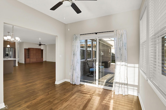 6153 Dugan Dr, Whitestown, IN 46075 - unfurnished room with a ceiling fan, dark wood-style flooring, baseboards, and a chandelier