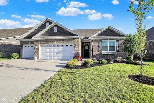 6153 Dugan Dr, Whitestown, IN 46075 - view of front of house featuring brick siding, an attached garage, driveway, and a front yard