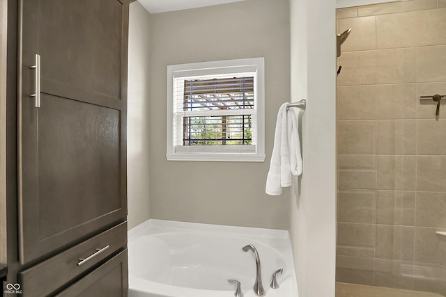 6153 Dugan Dr, Whitestown, IN 46075 - bathroom featuring tiled shower and a bath