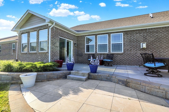 6153 Dugan Dr, Whitestown, IN 46075 - back of property with brick siding and a patio area