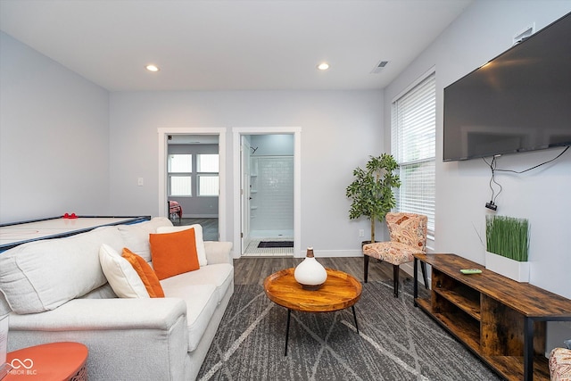 1009 Harrison St, Indianapolis, IN 46202 - living area featuring plenty of natural light, wood finished floors, recessed lighting, and baseboards