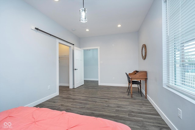 1009 Harrison St, Indianapolis, IN 46202 - bedroom with recessed lighting, baseboards, dark wood-style flooring, a spacious closet, and a barn door