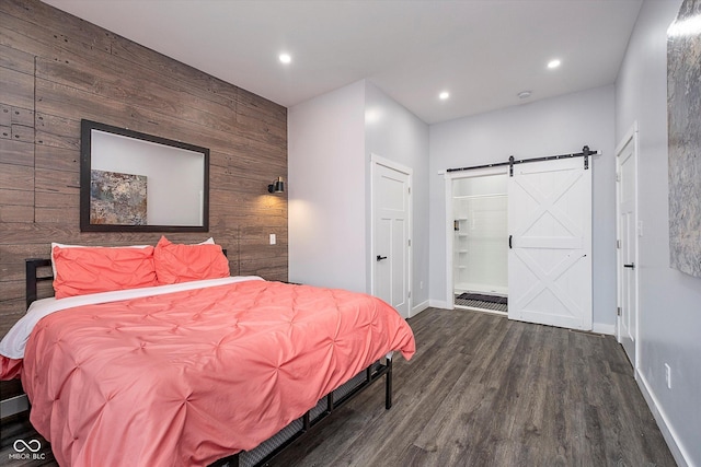 1009 Harrison St, Indianapolis, IN 46202 - bedroom featuring wood walls, baseboards, wood finished floors, a barn door, and recessed lighting