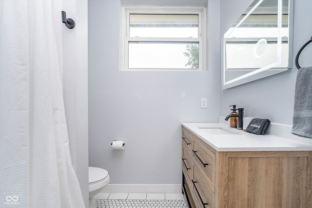 1009 Harrison St, Indianapolis, IN 46202 - bathroom with tile patterned flooring, toilet, vanity, and baseboards