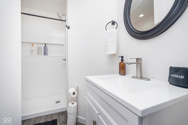 1009 Harrison St, Indianapolis, IN 46202 - full bathroom featuring wood finished floors, a stall shower, and vanity