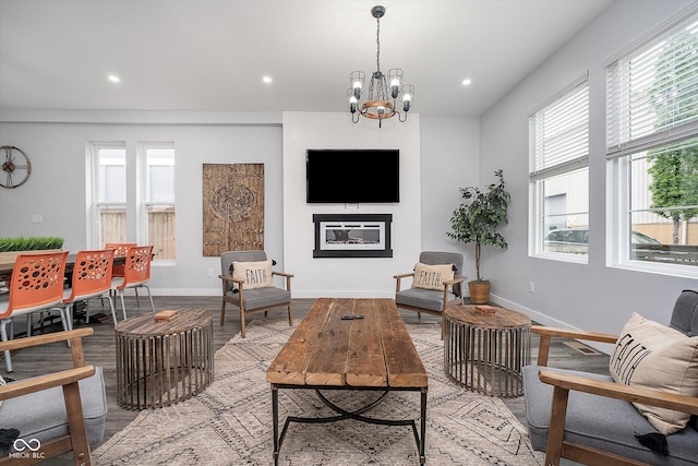 1009 Harrison St, Indianapolis, IN 46202 - living area with baseboards, recessed lighting, wood finished floors, a chandelier, and a large fireplace