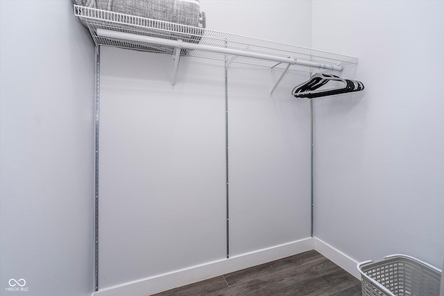 1009 Harrison St, Indianapolis, IN 46202 - spacious closet featuring dark wood-style floors