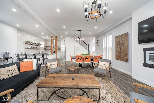 1009 Harrison St, Indianapolis, IN 46202 - living room featuring wood finished floors, stairs, a chandelier, recessed lighting, and baseboards