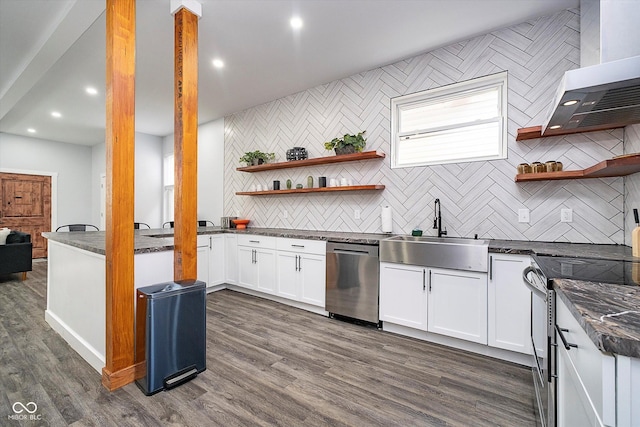 1009 Harrison St, Indianapolis, IN 46202 - kitchen featuring open shelves, appliances with stainless steel finishes, wall chimney exhaust hood, backsplash, and a sink