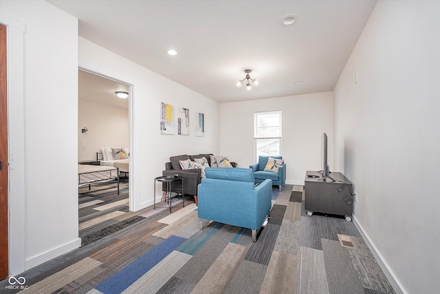 1009 Harrison St, Indianapolis, IN 46202 - carpeted living room with baseboards, recessed lighting, and a chandelier