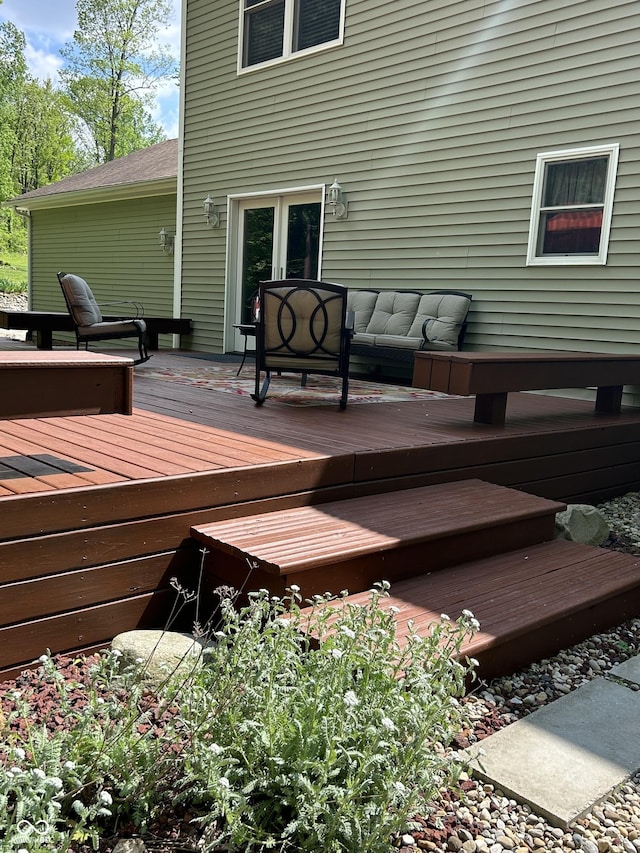 wooden deck featuring an outdoor hangout area