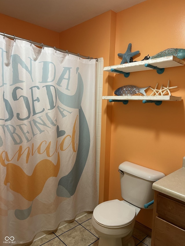 bathroom featuring toilet, tile patterned flooring, vanity, and a shower with curtain