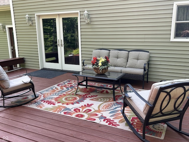 wooden deck featuring french doors and outdoor lounge area