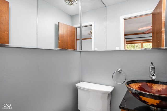 half bath featuring toilet and vanity