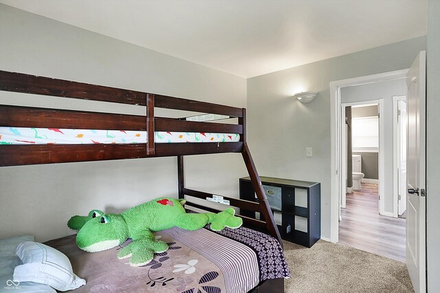 carpeted bedroom with baseboards