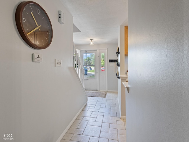 entryway featuring baseboards