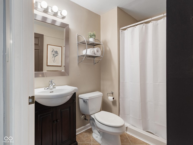 bathroom with tile patterned floors, vanity, toilet, and a shower with curtain