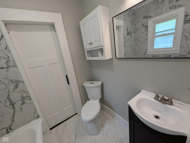 1009 Chestnut St, Anderson, IN 46012 - full bath featuring marble look tile flooring, vanity, toilet, and baseboards
