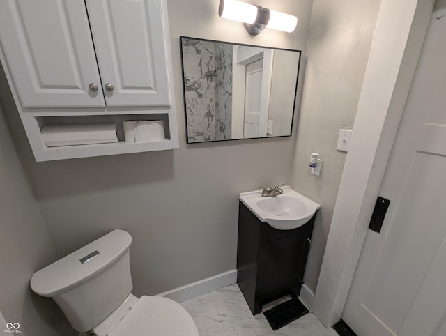 1009 Chestnut St, Anderson, IN 46012 - bathroom with vanity, marble finish floors, baseboards, and toilet
