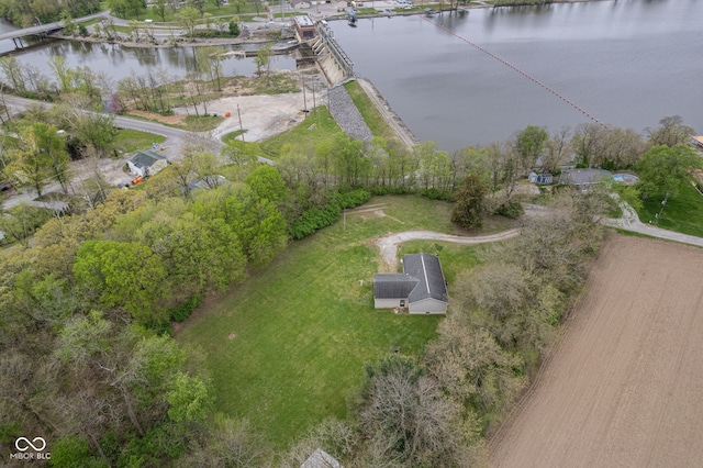 aerial view of property and surrounding area featuring a large body of water