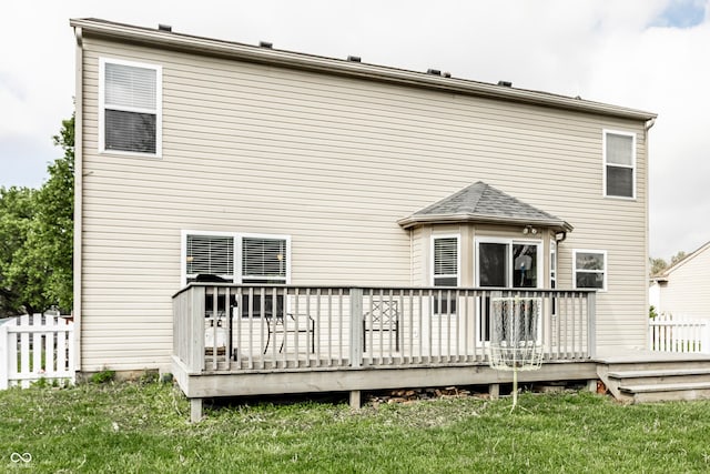 back of house featuring a wooden deck