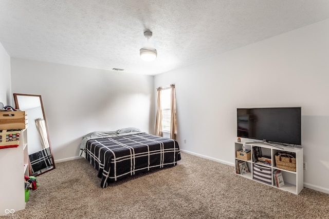 bedroom with carpet floors and baseboards