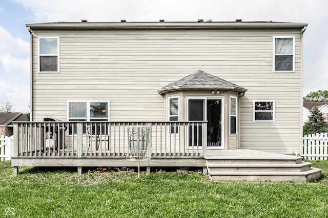 back of property featuring a deck