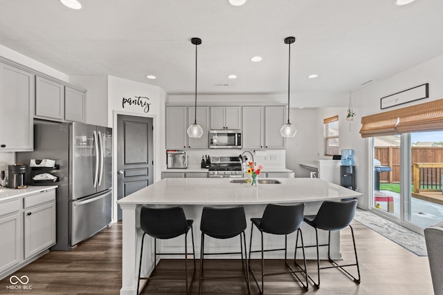 1289 Sunset Blvd, Avon, IN 46123 - kitchen with stainless steel appliances, a sink, dark wood-type flooring, light countertops, and recessed lighting