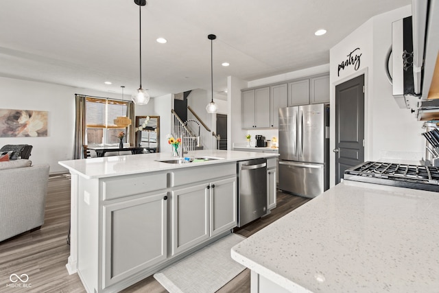 1289 Sunset Blvd, Avon, IN 46123 - kitchen featuring appliances with stainless steel finishes, a sink, gray cabinets, recessed lighting, and wood finished floors
