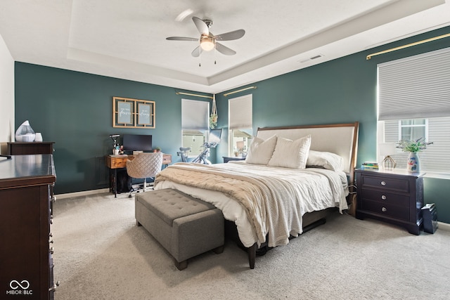1289 Sunset Blvd, Avon, IN 46123 - carpeted bedroom with a raised ceiling, an office area, multiple windows, and ceiling fan