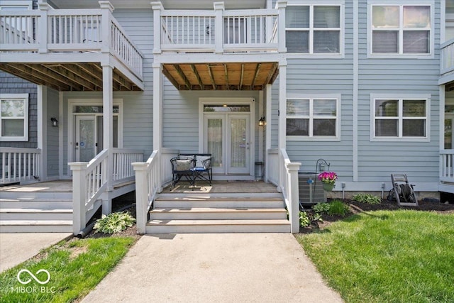 2405 N Park Ave, Indianapolis, IN 46205 - property entrance featuring a balcony, central air condition unit, and covered porch