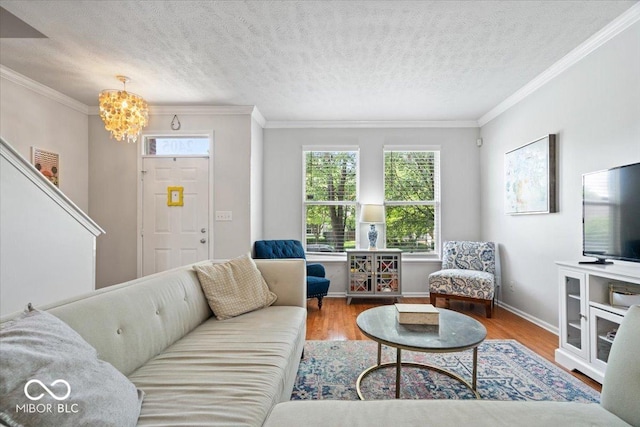 2405 N Park Ave, Indianapolis, IN 46205 - living room featuring a chandelier, healthy amount of natural light, wood finished floors, ornamental molding, and baseboards