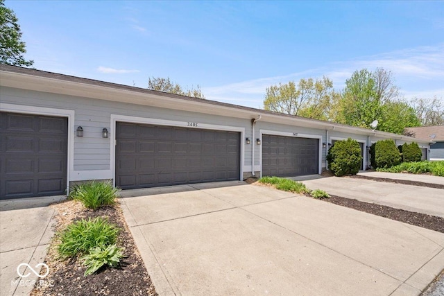 2405 N Park Ave, Indianapolis, IN 46205 - view of front of home featuring driveway and a garage