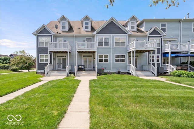 2405 N Park Ave, Indianapolis, IN 46205 - view of property featuring a balcony, central AC unit, a front lawn, and french doors