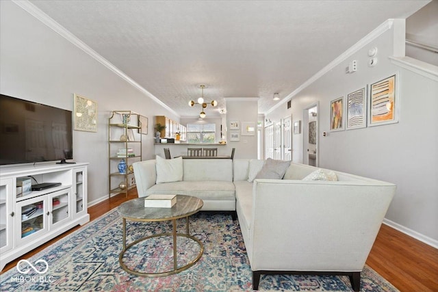 2405 N Park Ave, Indianapolis, IN 46205 - living area featuring crown molding, wood finished floors, and baseboards