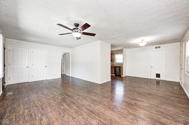 unfurnished living room featuring dark wood finished floors, a ceiling fan, baseboards, and a textured ceiling