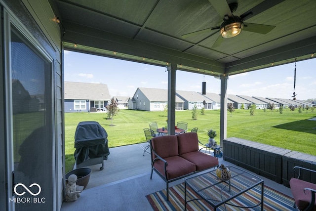 view of patio with outdoor lounge area, a residential view, ceiling fan, and area for grilling